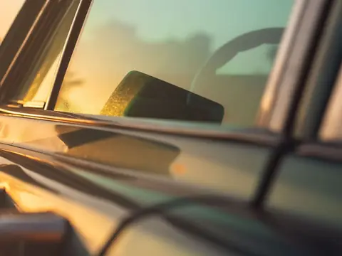 Evening light along a car door and its side window